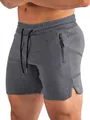 Gros plan sur le short de sport gris avec poche latérale zippée et taille élastique - S / Bas / Gris foncé
