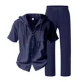 Detail view showing texture and buttons of blue linen hooded shirt and pants set - Navy Blue