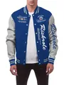 Detailed view of the varsity jacket's white script embroidery and navy fabric. - S / Tops / Sapphire Blue