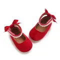 Red velvet baby girl Mary Jane shoes with pearl trim and ribbon bow decoration. - Red