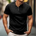 Close-up detail of a vintage black slub cotton Henley T-shirt worn by a model in an urban setting. - S / Tops / Black