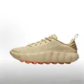 Detailed side profile of Mind 002 beige training shoe featuring unique orange massage pods. - Khaki