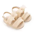 Vue détaillée de sandales beiges pour bébé fille avec nœuds en tulle et pompons - Abricot (Petit Nœud)