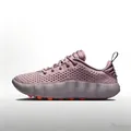 Close-up detail of mauve training shoes featuring perforated upper and massage pods - Pink