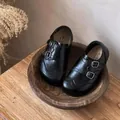 Close-up of black British style children's leather loafers with buckle and brogue detail - 23 / Double Monk Strap Style (TH-101) / Black