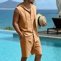 Detail view of a men's orange linen hooded sleeveless shirt and cargo shorts set by a pool - Earthy Yellow