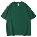 Vue de face d'un t-shirt à manches courtes vert foncé oversize à plat sur fond blanc. - S / Hauts / Vert Foncé
