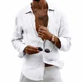 Detail view of men's loose white linen long-sleeved shirt with a classic turndown collar. - S / Tops / White