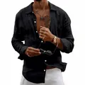 Detailed view of black linen shirt showing textured fabric and white buttons. - S / Tops / Black