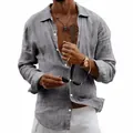 Detailed view of a men's casual loose grey linen shirt paired with white pants - Dark Gray