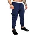 Close-up detail of navy blue cargo sweatpants featuring zipper pockets and drawstring waistline - S / Bottoms / Navy Blue