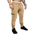 Close-up detail of khaki men's cargo joggers showing functional side pockets and fit - Khaki