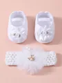 Detail view of white newborn baby shoes and matching flower headband gift set. - Size 11 (Inner Length 10.5cm) / Rose White