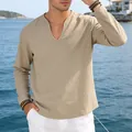 Close-up of khaki linen V-neck shirt showing relaxed fit and natural fabric texture - Khaki