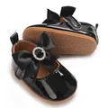 Detailed view of shiny black patent baby shoes with rhinestone bow and soft sole - Insole Length 11cm / Black