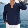 Close-up detail of navy blue linen V-neck long sleeve shirt worn by a male model - Navy Blue