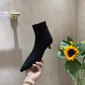 Elegant black pointed-toe stiletto stretch ankle boots with matte finish detail - 38 / Black