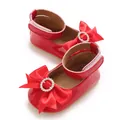Close-up detail of red baby princess shoes featuring a large satin bow with rhinestones. - Insole Length 11cm / Red