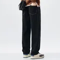 Back view detail showing men's black straight-leg thin denim jeans for summer style - 28 / Bottoms / Black