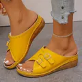 Close-up of yellow wedge sandals with double buckle detail and peep toe design - Yellow