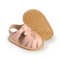 Detail view of pink baby walking sandals with embroidered flower and soft anti-slip sole - 11cm / Pink