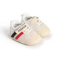 Detailed view of breathable mesh baby walking shoes in beige with striped velcro strap - Red Black Stripes (NC-516)