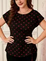 Close-up detail of women's plus size black top with red heart print and side waist tie - Black