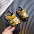 Yellow closed-toe baby sandals with a cartoon bear design and soft toddler soles - Yellow