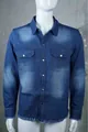 Macro view of men's distressed denim shirt showing frayed hem and snap buttons - S / Tops / Blue