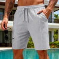 Détail du tissu gaufré des shorts de sport décontractés pour hommes en gris chiné - Gris clair