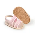 Soft pink baby girl sandals with decorative pom-pom straps and non-slip rubber soles - 11cm / Pink