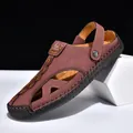 Detailed view of brown leather men's closed-toe sandals with adjustable two-way strap. - 38 / Red
