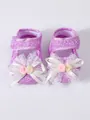 Detailed view of purple baby girl princess shoes with lace bows and soft soles - Purple