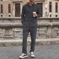 Close-up of men's dark grey corduroy casual shirt and trousers set in urban setting - S / Top And Bottom / Gray