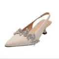 Elegant beige pointed-toe slingback heels with sparkling rhinestone butterfly decor - Ivory