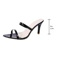 Detail view of black patent stiletto mule with 9cm heel height measurement - Black