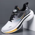 Men's breathable mesh running shoes with gray gradient design and cushioned sole - Grey Orange