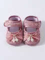 Detail view of baby girl pink lace princess shoes with elegant ribbon bows and pearls - Dusty Pink