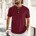 Detailed close-up of a burgundy slim-fit short sleeve Henley t-shirt with a chest pocket - S / Tops / Burgundy