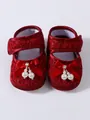 Detailed close-up view of red lace baby princess shoes decorated with elegant pearl bows - Burgundy