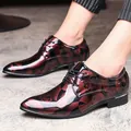 Detailed view of men's glossy patent leather dress shoes with floral pattern - 38 / Red