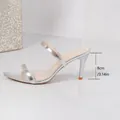 Side profile of silver pointed-toe stiletto sandals featuring an 8cm high heel measurement - 35 / Silver