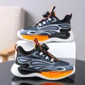 Boy's athletic sneakers featuring a rotary buckle in vibrant orange and blue design. - Black Orange Floral