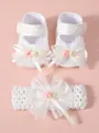 Detailed view of white lace baby shoes and matching headband set with floral bows - 11 (10.5cm) / Shoe and Headband Set / White