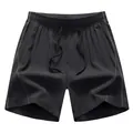 Black men's quick-dry sports shorts with drawstring waist and contrast stitching. - Black