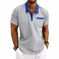 Detail view of men's grey waffle knit polo shirt with blue contrast collar and pocket - Light Gray