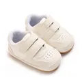 Soft white infant walking shoes with anti-slip rubber soles and double velcro straps - White