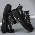 Durable black safety shoes featuring breathable mesh panels and thick MD anti-slip sole - 39 / Black