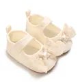 Close-up detail of cream infant girl walker shoes featuring a delicate lace bow decoration - Inner Length 11cm / Apricot