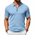 Close-up of men's blue vintage jacquard polo shirt with zipper and textured fabric detail. - Light Blue